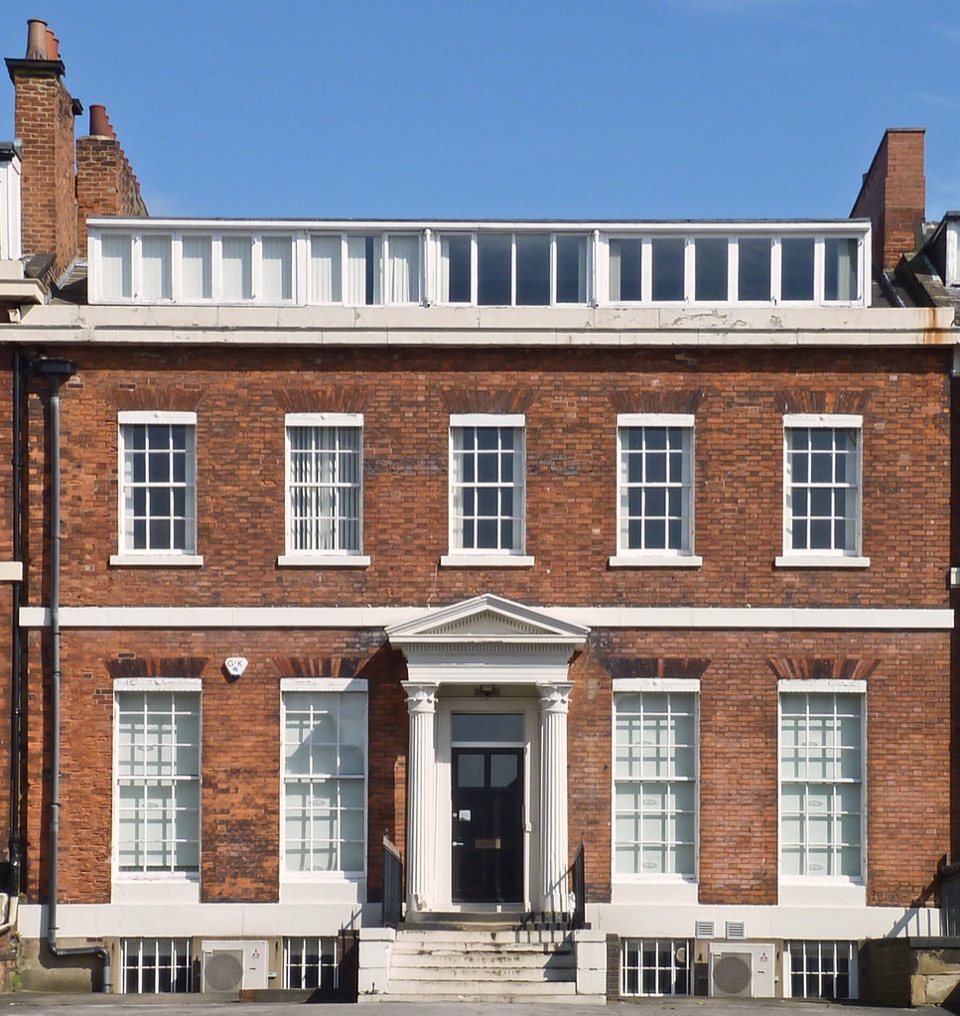 A brick frontage with sash windows on Blenheim Terrace in Leeds